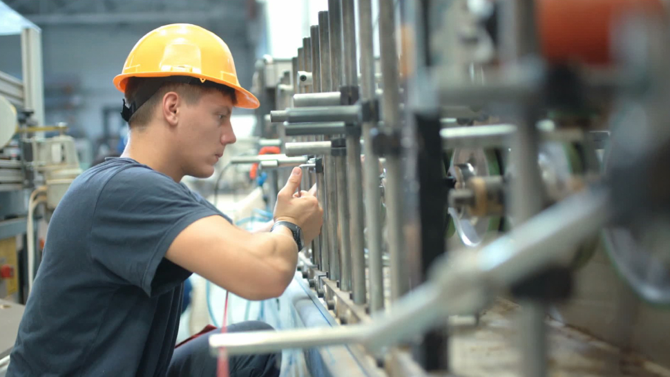 Image showing the mechanic repairing the industrial equipment.