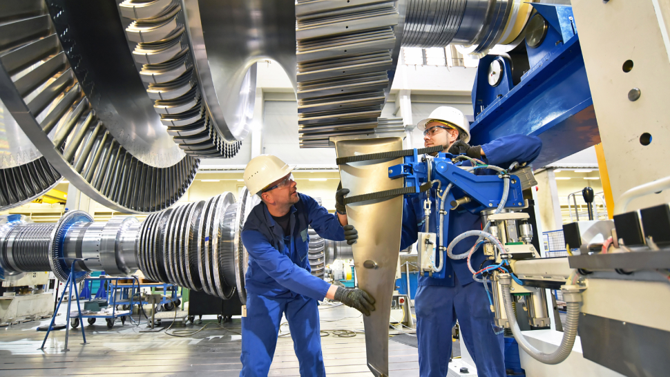 Image representing two industrial operaters working in the manufacturing sector.