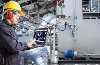 Image showing an automobile engineer checking the quality of a product.