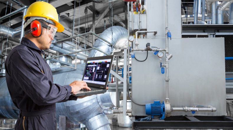 Image showing an automobile engineer checking the quality of a product.
