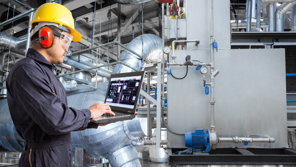 Image showing an automobile engineer checking the quality of a product.