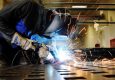 Image Showing A Welder Welding An Iron - Representing Tools & Equipments Usage Of Stainless STeel Fabricating Company.