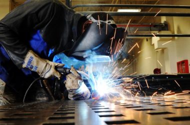 Image Showing A Welder Welding An Iron - Representing Tools & Equipments Usage Of Stainless STeel Fabricating Company.