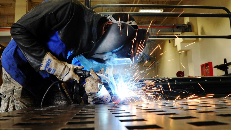 Image Showing A Welder Welding An Iron - Representing Tools & Equipments Usage Of Stainless STeel Fabricating Company.
