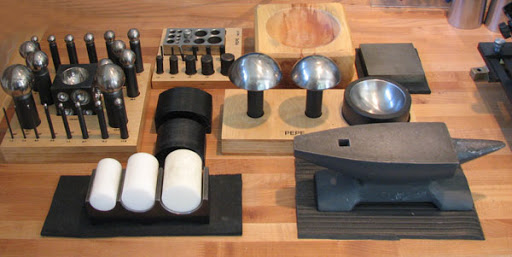 Collection Of Tools And Equipments Arranged In A Table For An Industrial Purpose.